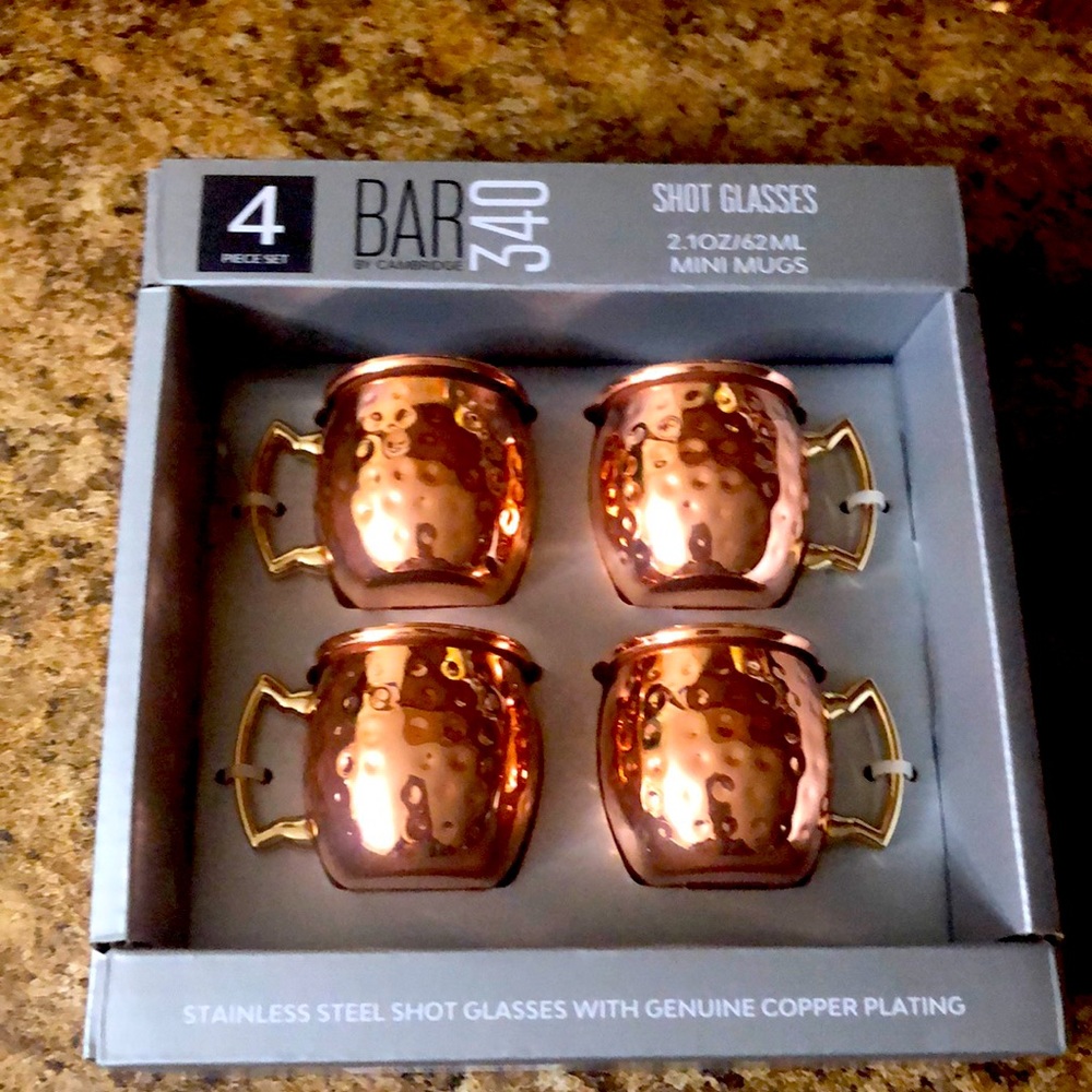 Four Moscow Mule mugs as tiny shot glasses